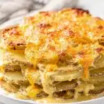 Easy cheesy scalloped potatoes recipe with golden bubbly cheese crust
