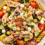 Fresh high protein Italian pasta salad with creamy mozzarella and glossy dressing.