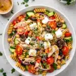 Easy high protein Italian pasta salad with chicken and vegetables in a bowl.