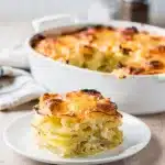 Golden brown scalloped potatoes with creamy layers and crispy cheese edges