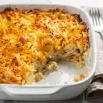 Creamy crockpot cheesy hashbrown casserole with golden melted cheese topping.