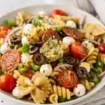 Colorful Italian pasta salad recipe with rotini, fresh vegetables, and pepperoni.