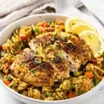 Creamy lemon herb chicken orzo skillet with golden seared chicken pieces
