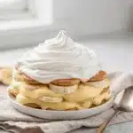 Classic banana pudding recipe with creamy layers and vanilla wafers in a glass bowl.