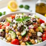 Easy Mediterranean chickpea salad with feta olives and fresh herbs in bowl
