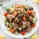 Close up of vibrant Mediterranean tuna salad with creamy dressing and fresh vegetables