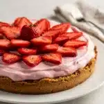 Creamy no bake strawberry pie with glossy glaze and fresh sliced berries.