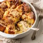 Golden brown overnight French toast bake with cinnamon streusel and blueberries.