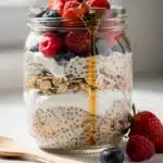 High protein overnight oats with blueberries and almonds in glass jar