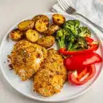 Easy parmesan crusted sheet pan chicken with roasted potatoes and broccoli dinner.