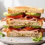 No cook turkey club sandwich with avocado and bacon on sourdough bread