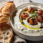 Creamy whipped feta dip with juicy roasted tomatoes and fresh dill.