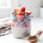 Creamy vanilla chia seed pudding topped with fresh berries and almond butter.