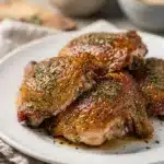 Crispy baked ranch chicken thighs with golden skin and fresh herbs