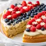 Patriotic Fourth of July sugar cookie cake with berries.