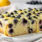 Lemon blueberry sheet cake with creamy glaze and tender crumb close up