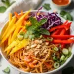 Mango Sriracha cold rice noodle bowl close up