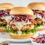 Grilled chicken sliders topped with red cabbage and blueberry slaw for a patriotic meal.