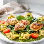 Creamy pesto chicken and cheese tortellini in a rustic one pan dinner.