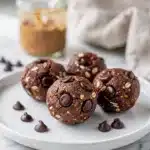 Chocolate almond butter protein balls coated in creamy chocolate