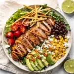 High protein grilled chicken taco salad with chipotle crema.