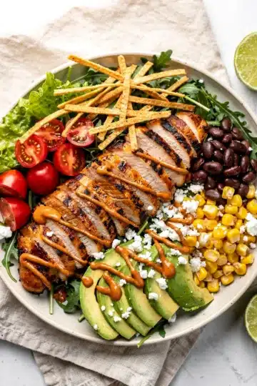 High protein grilled chicken taco salad with chipotle crema.