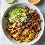 Leftover BBQ chicken street corn bowl with creamy sauce.